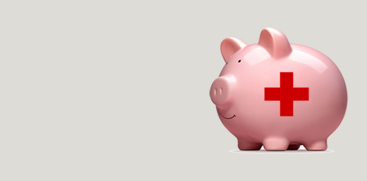 piggy bank with red cross